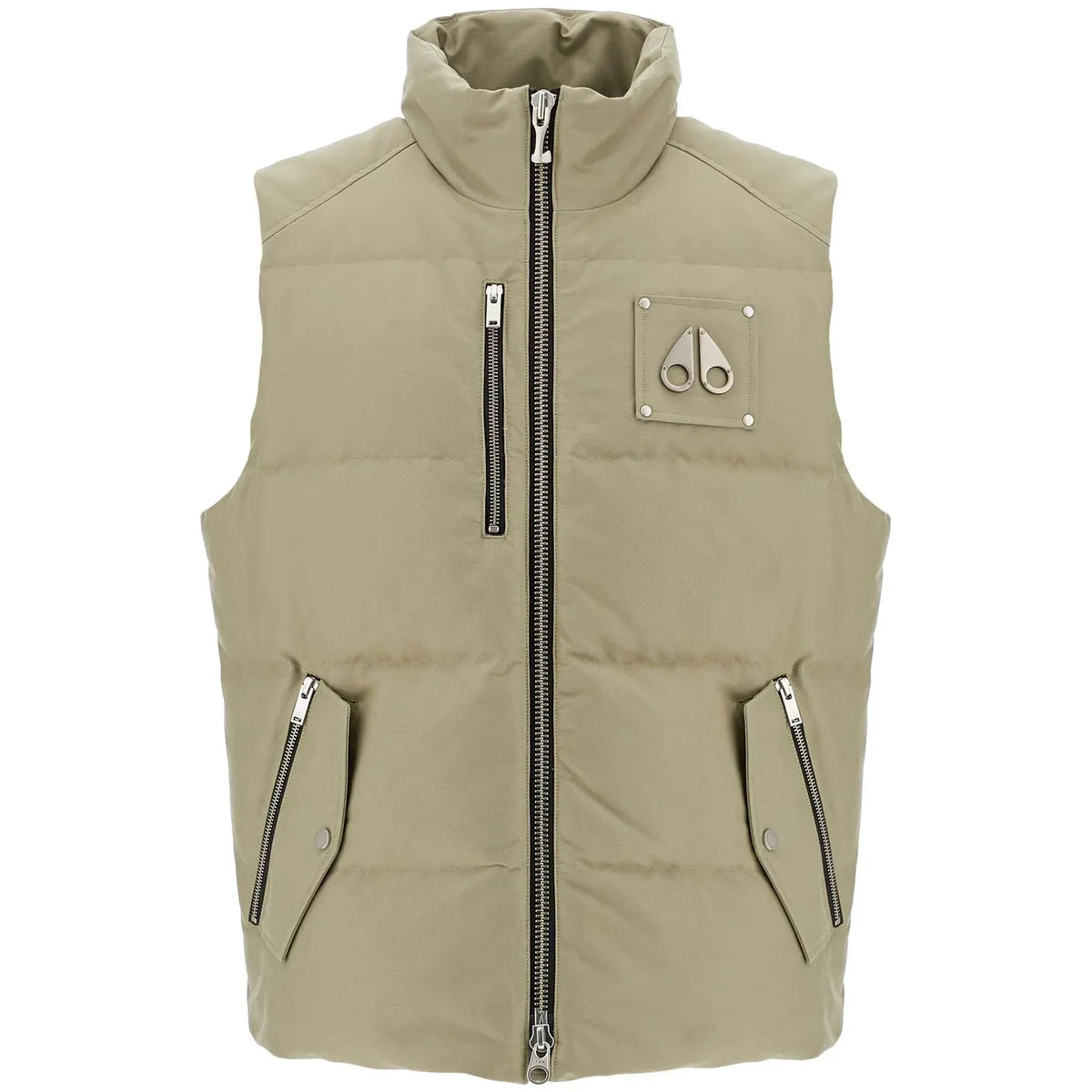 A sleeveless quilted puffer vest in a light khaki-beige color, featuring a high stand-up collar, a central front zipper, two vertical zippered chest pockets, and two diagonal zippered hand pockets. A small metallic logo patch is visible on the left chest.